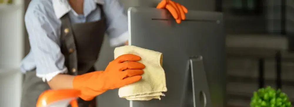 Office computer being wiped during commercial cleaning in Hartford, CT