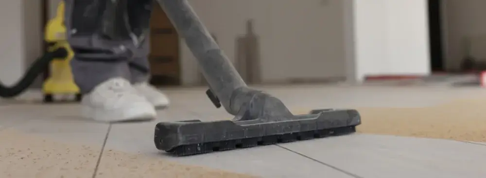 Vacuuming construction dust from floor after renovation in Newington, CT