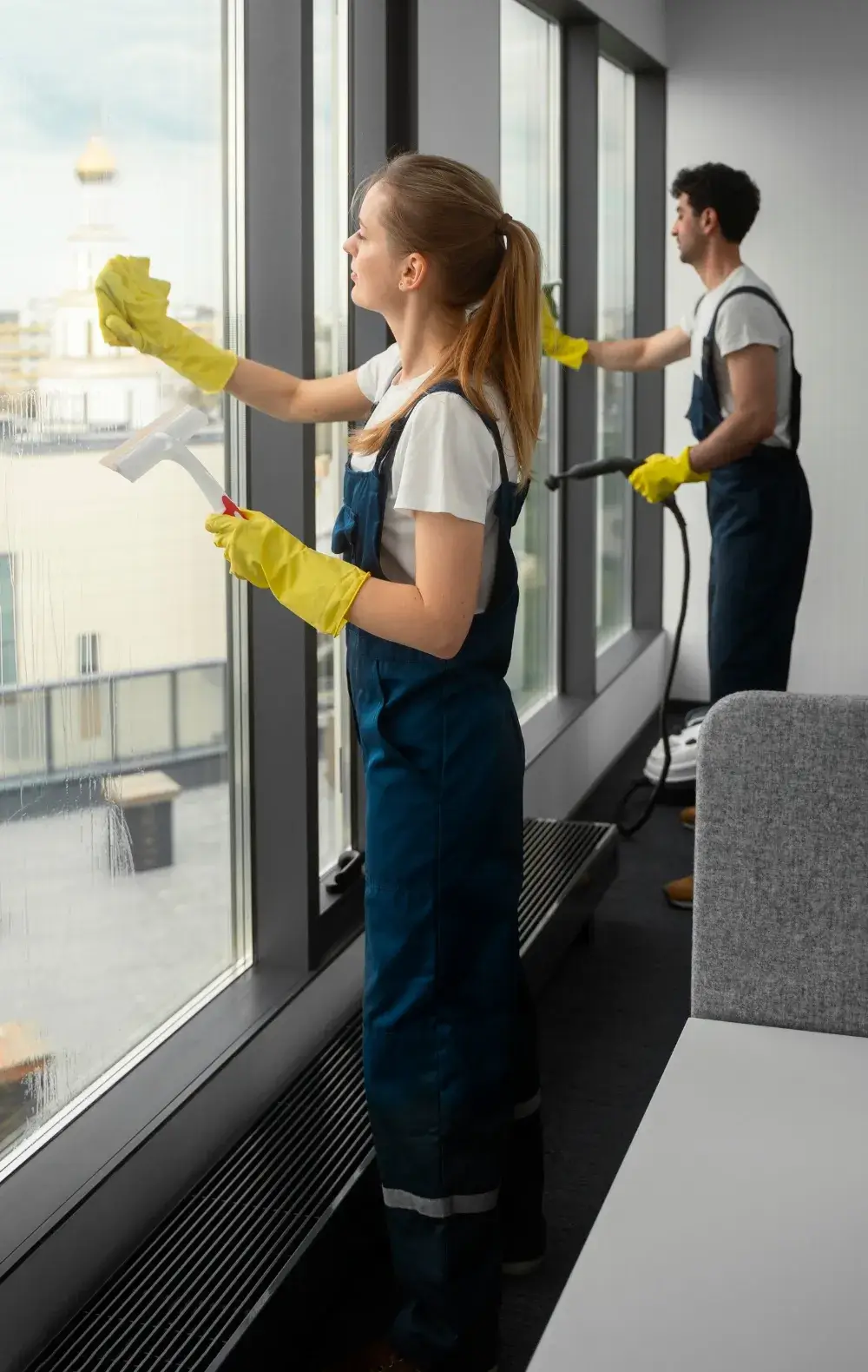 Professional window cleaning team working in a modern office in Hartford, CT.